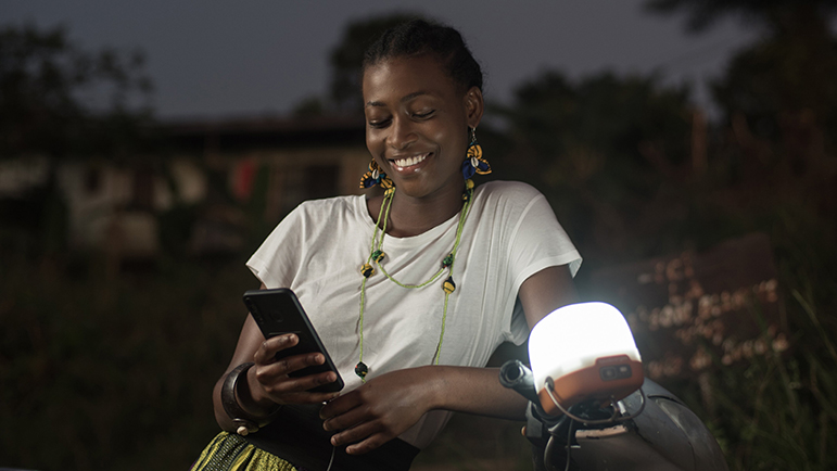 woman with a solar lamp hung on her scooter